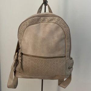 Style & Co. Medium Sized Backpack with floral print lining.